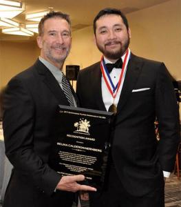 Danny Nernberg and Kevin Tagarao receiving Belina’s award on her behalf.